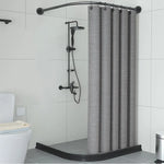Tringle de douche noire fixée au mur d’une salle de bain design avec rideau gris et robinetterie noire