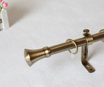 Tringle à rideaux en métal avec design ancien et embout en forme de trompette