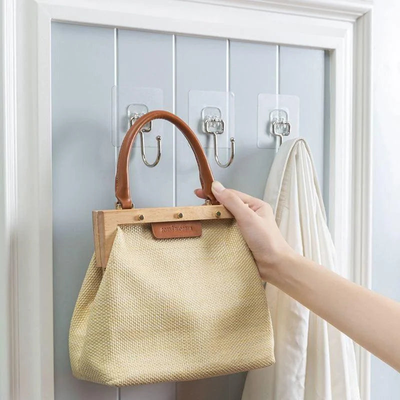 Porte-manteaux adhésif mural pratique avec crochets en métal pour organiser sacs à main et vêtements dans l'entrée. Solution de rangement facile à installer pour économiser de l'espace et maintenir l'ordre chez soi. Idéal pour les petites surfaces et les appartements.