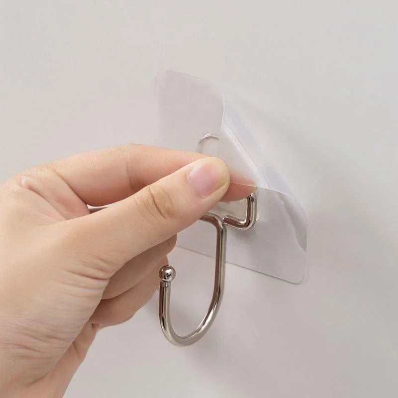 Crochet adhésif mural, facile à installer, idéal pour suspendre accessoires dans la cuisine ou la salle de bain, solution pratique et discrète pour organiser vos espaces sans percer.