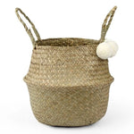Panier de rangement élégant avec anses, parfait pour une décoration naturelle de la maison. Idéal pour organiser divers objets dans le salon, la chambre ou la salle de bain. Accessoire déco tendance avec des pompons décoratifs.