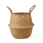 Panier tressé décoratif avec poignées, idéal pour le rangement ou comme cache-pot dans un intérieur moderne et cosy. Accessoire pratique pour l'organisation et l'embellissement de votre espace de vie.