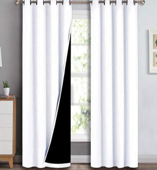 Rideaux isolants thermiques blancs avec œillets, parfaits pour bloquer la lumière et économiser l'énergie dans une pièce moderne et élégante. Idéal pour la chambre à coucher ou le salon, ce modèle combine fonctionnalité et design épuré, créant une atmosphère cosy et accueillante. Disponibles dans plusieurs tailles pour s'adapter à vos fenêtres.