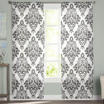 Image de rideaux élégants avec un motif floral noir et blanc, idéal pour ajouter une touche de sophistication à votre salon. Ces rideaux décoratifs offrent une belle lumière naturelle en filtrant la lumière du jour, tout en préservant l'intimité de votre espace intérieur. Transformez votre pièce avec ce design moderne et intemporel, parfait pour toute décoration intérieure contemporaine.