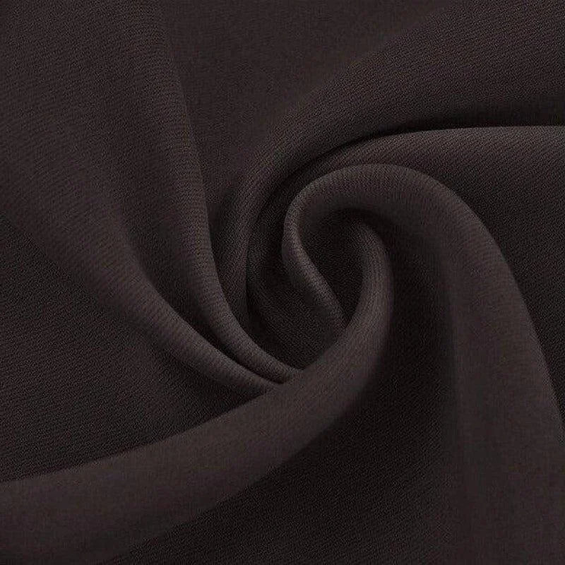 Texture élégante de tissu noir tournoyant, parfait pour créations de mode et décoration intérieure raffinée.