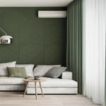 Canapé élégant avec coussins dans un salon moderne au décor vert. Mur d'accent texturé avec rideaux assortis. Idéal pour un espace de détente contemporain et stylé.