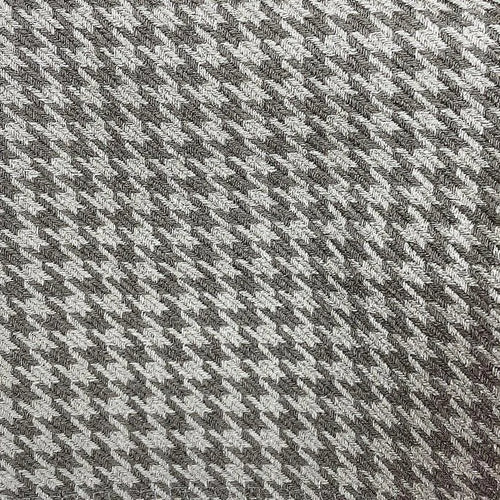 Motif pied-de-poule gris et blanc en gros plan, parfait pour vêtements tendance et accessoires de mode. Design intemporel et élégant, idéal pour ajouter une touche de sophistication à toute tenue.