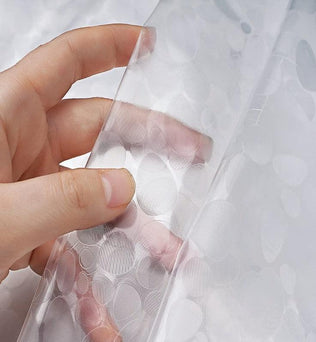 Film adhésif décoratif transparent avec motifs circulaires, idéal pour la personnalisation de fenêtres et la protection de surfaces, facile à appliquer et à retirer.