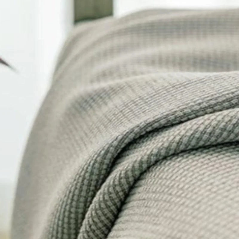 Couverture texturée gris clair pour chambre moderne, idéale pour apporter chaleur et style à votre intérieur. Parfait pour les soirées fraîches ou pour rehausser la décoration de votre lit avec une touche élégante et confortable.