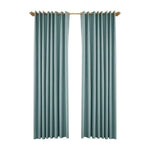 Rideaux élégants bleu canard pour salon, avec une fixation élégante, idéaux pour une décoration intérieure moderne et sophistiquée. Ces rideaux offrent une touche de couleur apaisante et une finition raffinée pour transformer votre espace de vie.