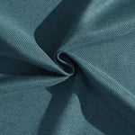 Texture en teinte bleu canard, caractérisée par un tissage serré et régulier, idéale pour la décoration intérieure et la confection de vêtements modernes. Évoque une ambiance apaisante et raffinée.