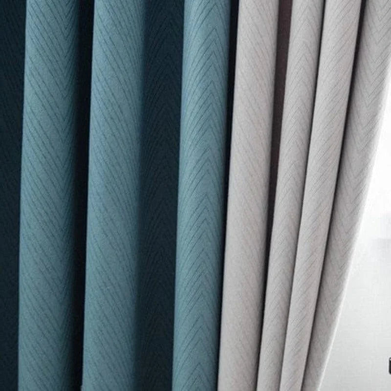 Rideaux modernes à motifs géométriques, disponibles en différentes nuances de bleu et de gris, parfaits pour ajouter une touche élégante à votre intérieur.