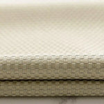 Image montrant un tissu beige avec un motif tissé en relief, idéal pour la décoration intérieure et le design moderne. Texture élégante et polyvalente pour des projets de couture et de confection personnalisés. Parfait pour ajouter une touche de sophistication à tout espace de vie.
