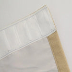 Photo d’un rideau beige et blanc avec bandeau supérieur pour fixation facile. Design épuré idéal pour salons contemporains, apportant élégance et fonctionnalité à votre intérieur. Accessoire décoratif essentiel pour parfaire votre espace de vie.