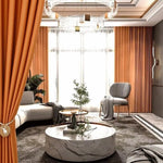 Salon moderne et élégant avec rideaux orange, mobilier contemporain, table basse ronde au design chic, et décoration intérieure sophistiquée. Parfait pour créer un espace de vie harmonieux et accueillant.