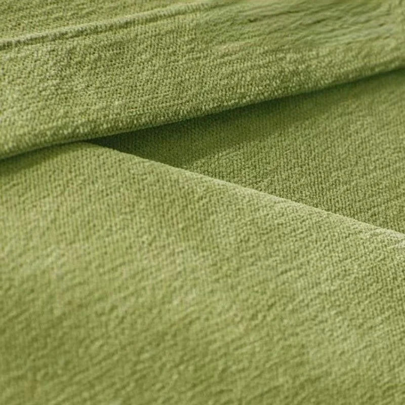 Tissu vert doux et élégant pour ameublement, idéal pour canapé ou fauteuil, apportant une touche de fraîcheur et de modernité à votre intérieur.