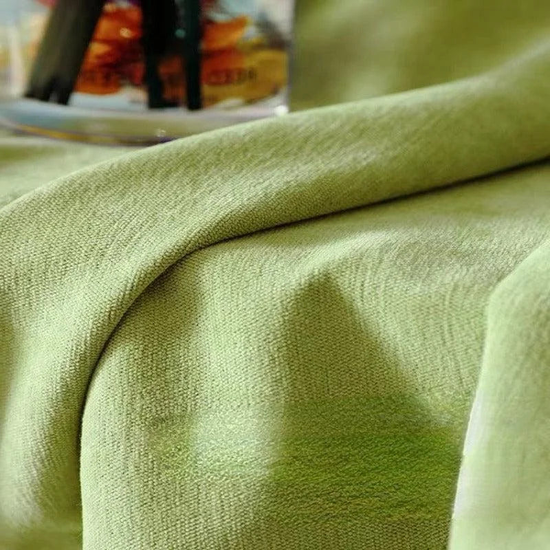 Texture douce d’un tissu vert lumineux, idéal pour les décorations intérieures modernes. Le tissu présente une teinte apaisante qui rehausse l’ambiance d'une pièce. Parfait pour créer une atmosphère chaleureuse et accueillante.