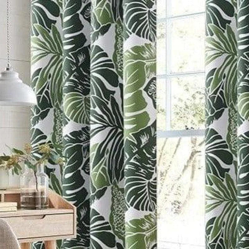 Rideau design tropical avec motif de feuilles vertes, idéal pour ajouter une touche naturelle et exotique à la décoration intérieure. Convient parfaitement pour un salon, une chambre ou tout espace nécessitant une ambiance rafraîchissante et moderne. Disponible pour fenêtres de différentes tailles.