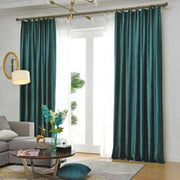 rideau vert foncé velours moderne opacité haute tringle dorée plis élégants salle salon contemporain