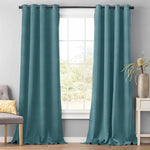 Paire de rideaux bleu turquoise pour salon moderne, idéale pour apporter une touche élégante et colorée à votre intérieur. Complément parfait pour les fenêtres, offrant style et intimité.