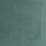 Texture uni de couleur vert foncé, idéale pour la décoration intérieure moderne, offrant une apparence élégante et sobre qui s'intègre parfaitement dans divers styles d'ameublement.