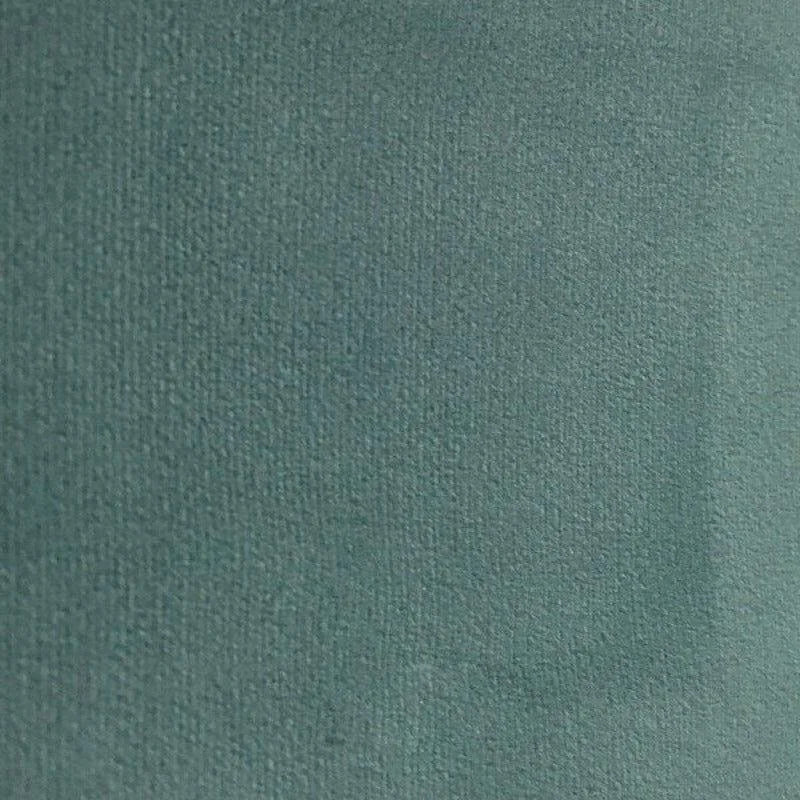 Texture uni de couleur vert foncé, idéale pour la décoration intérieure moderne, offrant une apparence élégante et sobre qui s'intègre parfaitement dans divers styles d'ameublement.