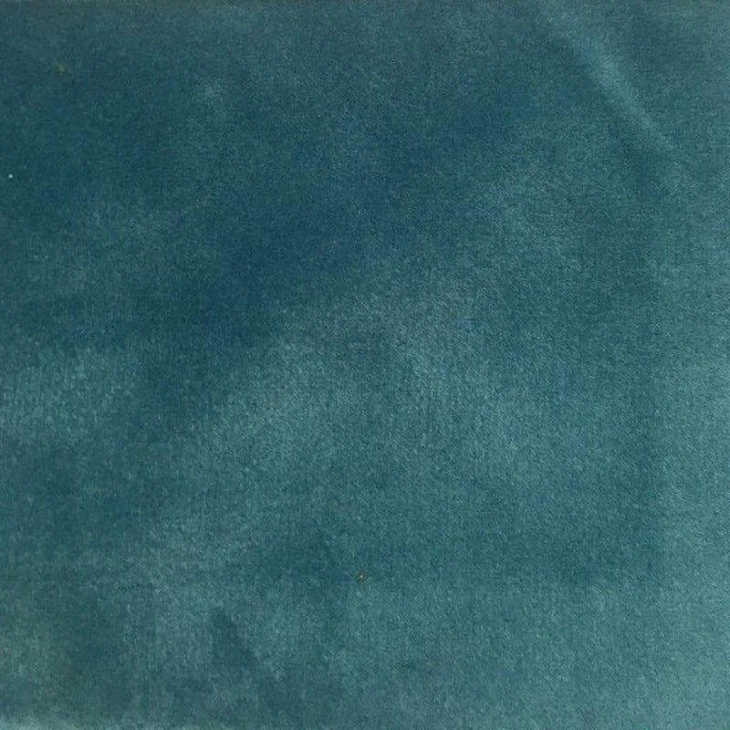 Image d'un tissu bleu canard uni, idéal pour apporter une touche sophistiquée et élégante à votre décoration intérieure. Parfait pour des projets de couture ou de recouvrement de meubles, ce tissu aux tons profonds s'adapte facilement à divers styles de design.