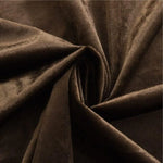 Image d'un tissu marron de haute qualité avec des plis élégants, idéal pour la confection de vêtements et d'articles de décoration intérieure. Ce textile offre une apparence raffinée et sophistiquée, parfait pour créer des pièces uniques et personnalisées.