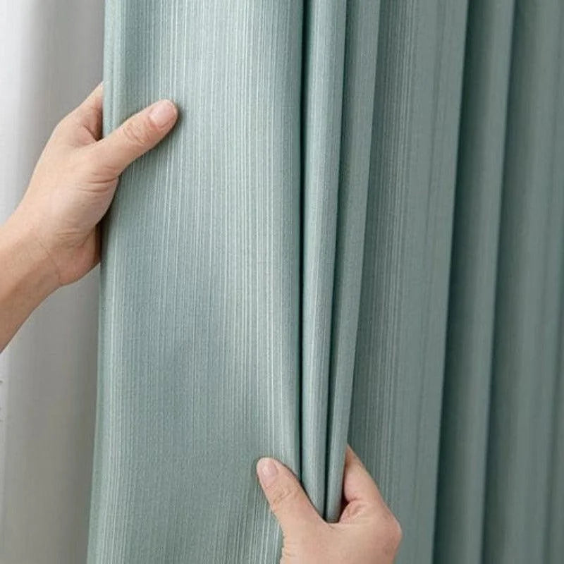 Rideau vert pastel élégant pour salon, parfait pour une décoration moderne et apaisante. Ce modèle combine fonctionnalité et esthétique, offrant une ambiance zen et lumineuse, idéal pour tout type d'intérieur.