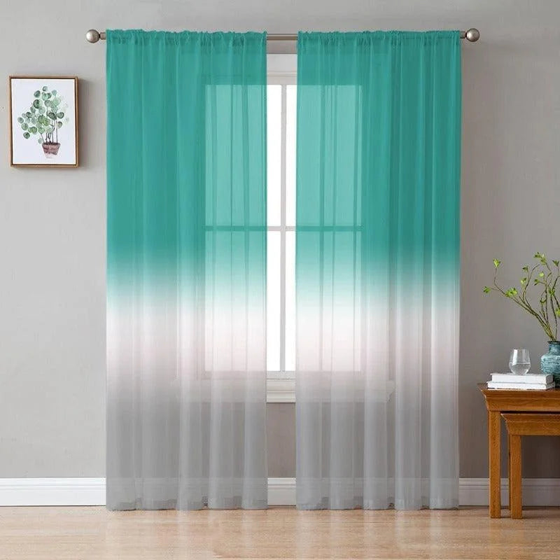 Rideaux dégradés turquoise et blancs pour salon, ajoutant une touche moderne et élégante à votre décoration intérieure. Idéal pour filtrer la lumière tout en offrant une ambiance apaisante et contemporaine. Design tendance parfait pour compléter un espace de vie lumineux.