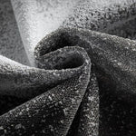 Tissu texturé noir et gris, idéal pour la décoration intérieure moderne et élégante. Parfait pour ajouter une touche sophistiquée à votre espace de vie avec un motif unique.