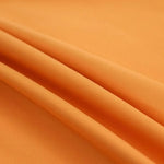 Tissu de couleur orange vif, idéal pour la confection de vêtements ou la décoration intérieure. Texture douce et élégante, parfait pour ajouter une touche de chaleur et de modernité à votre espace. Ce tissu polyvalent s'adapte à de nombreux usages créatifs et pratiques.