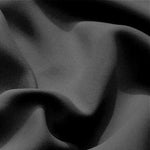 Texture sombre et élégante d'un tissu ondulé, créant un effet visuel raffiné et moderniste pour la décoration intérieure. Idéal pour ceux qui recherchent une ambiance contemporaine et sophistiquée.