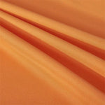 Tissu orange vibrant, idéal pour la confection de vêtements élégants ou accessoires de mode. Parfait pour créer des pièces uniques et tendance, ce tissu aux teintes chaudes apportera une touche colorée et énergique à toutes vos créations.
