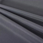 Image d'un tissu gris foncé, idéal pour la confection de vêtements élégants. Cette étoffe raffinée présente un aspect lisse et fluide, parfait pour la création de rideaux ou de robes sophistiquées. Découvrez une texture délicate qui allie style et fonctionnalité, parfaite pour les projets de couture haut de gamme.