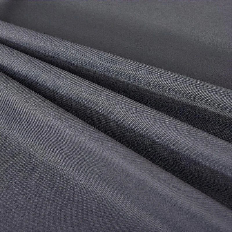 Image d'un tissu gris foncé, idéal pour la confection de vêtements élégants. Cette étoffe raffinée présente un aspect lisse et fluide, parfait pour la création de rideaux ou de robes sophistiquées. Découvrez une texture délicate qui allie style et fonctionnalité, parfaite pour les projets de couture haut de gamme.
