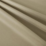 Produit textile beige avec texture en relief, adapté pour confection et décoration intérieure, offrant une apparence élégante et moderne.