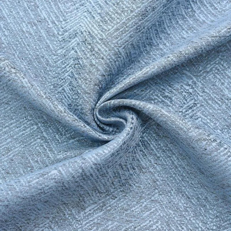 Gros plan sur un tissu bleu à motif géométrique, idéal pour la décoration d'intérieur et l'ameublement. Explorez ce design élégant et moderne pour vos projets de rideaux ou de meubles. Parfait pour apporter une touche de sophistication à n'importe quel espace de vie.