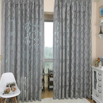 Rideaux élégants gris avec motifs décoratifs ondulés, parfaits pour ajouter une touche moderne à votre salon ou chambre. Ces rideaux opaques offrent une excellente isolation lumineuse et thermique, tout en rehaussant l'esthétique de votre décoration intérieure. Idéal pour créer une ambiance chaleureuse et accueillante dans n'importe quelle pièce.