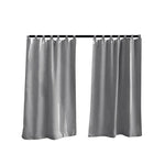 Paire de rideaux opaques gris avec œillets pour décoration intérieure, installation facile et élégance moderne, idéale pour salon ou chambre à coucher.