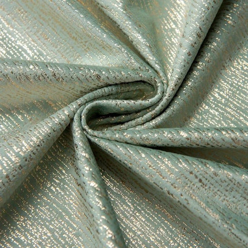 Image d'un tissu élégant aux reflets irisés, parfait pour la création de vêtements sophistiqués ou de décoration intérieure. Ce tissu offre un jeu de couleurs subtil entre des nuances de vert et des éclats métalliques, apportant une touche de luxe à vos projets créatifs. Idéal pour la confection de pièces uniques et modernes.