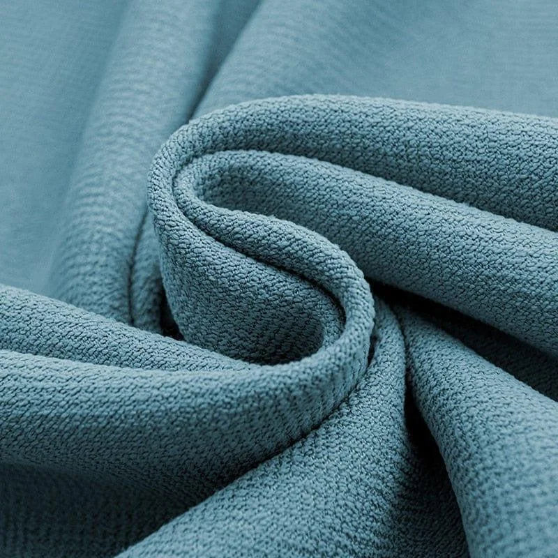 Texture douce et élégante d'un tissu bleu avec un motif finement tissé, parfait pour la décoration intérieure et l'habillement. Idéal pour créer une atmosphère sereine et moderne dans n'importe quelle pièce.