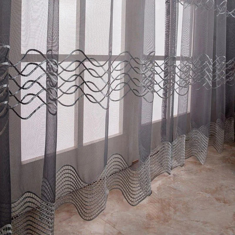 Rideaux élégants avec motifs ondulés, parfaits pour ajouter une touche de sophistication à votre intérieur. Ces voilages apportent une luminosité douce tout en préservant l'intimité de votre espace. Accessoire décoratif idéal pour salon ou chambre, alliant style moderne et fonctionnalité.