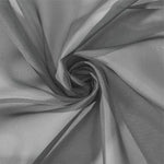 Image d'un tissu gris élégant drapé en spirale, idéal pour la confection de vêtements modernes ou pour la décoration intérieure chic. Ce textile offre une apparence raffinée avec ses nuances de gris, parfait pour ajouter une touche sophistiquée à tout projet créatif.