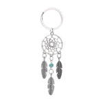 Porte-clés attrape-rêves avec plumes et perle décorative bleu, idéal comme accessoire tendance et symbolique pour sac ou trousseau de clés.