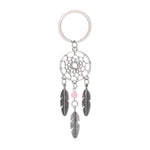 Porte-clés attrape-rêves avec motif circulaire et pendentifs en forme de plumes, idéal pour ajouter une touche spirituelle à vos accessoires quotidiens. Accessoire tendance parfait pour les amateurs de symboles mystiques.