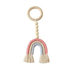 Attache tétine bébé arc-en-ciel pastel avec anneau et perles. Accessoire de puériculture tendance pour éveiller l’enfant. Ideal pour cadeaux de naissance ou décoration de chambre d'enfant. Design ludique et coloré pour stimuler les sens.