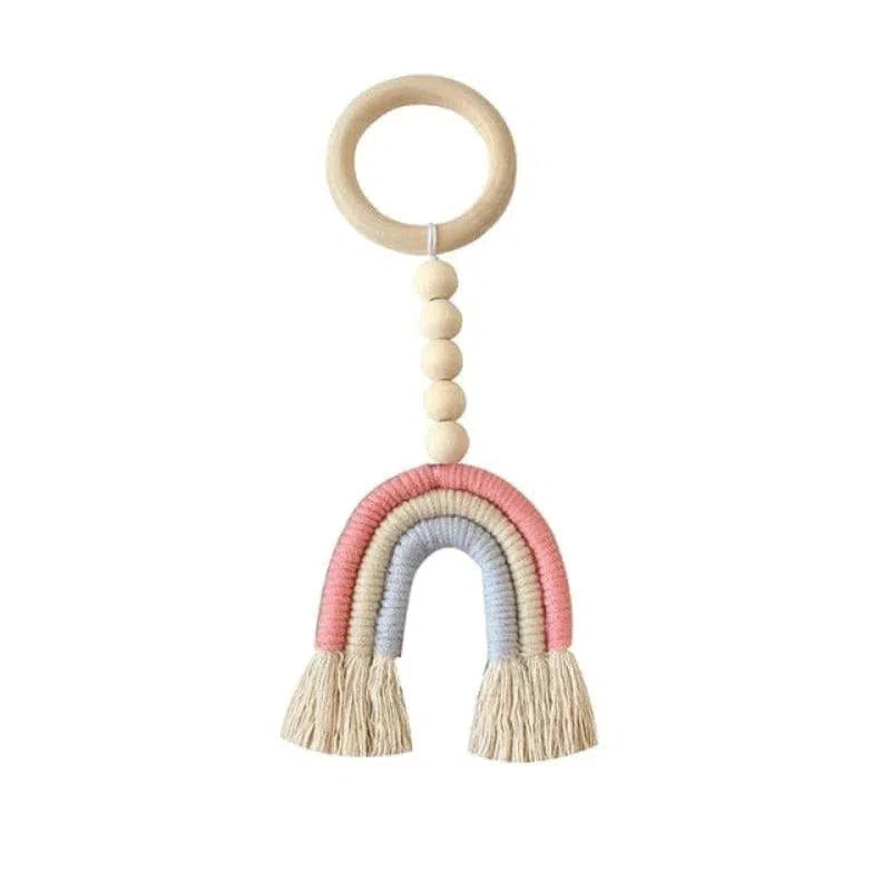 Attache tétine bébé arc-en-ciel pastel avec anneau et perles. Accessoire de puériculture tendance pour éveiller l’enfant. Ideal pour cadeaux de naissance ou décoration de chambre d'enfant. Design ludique et coloré pour stimuler les sens.