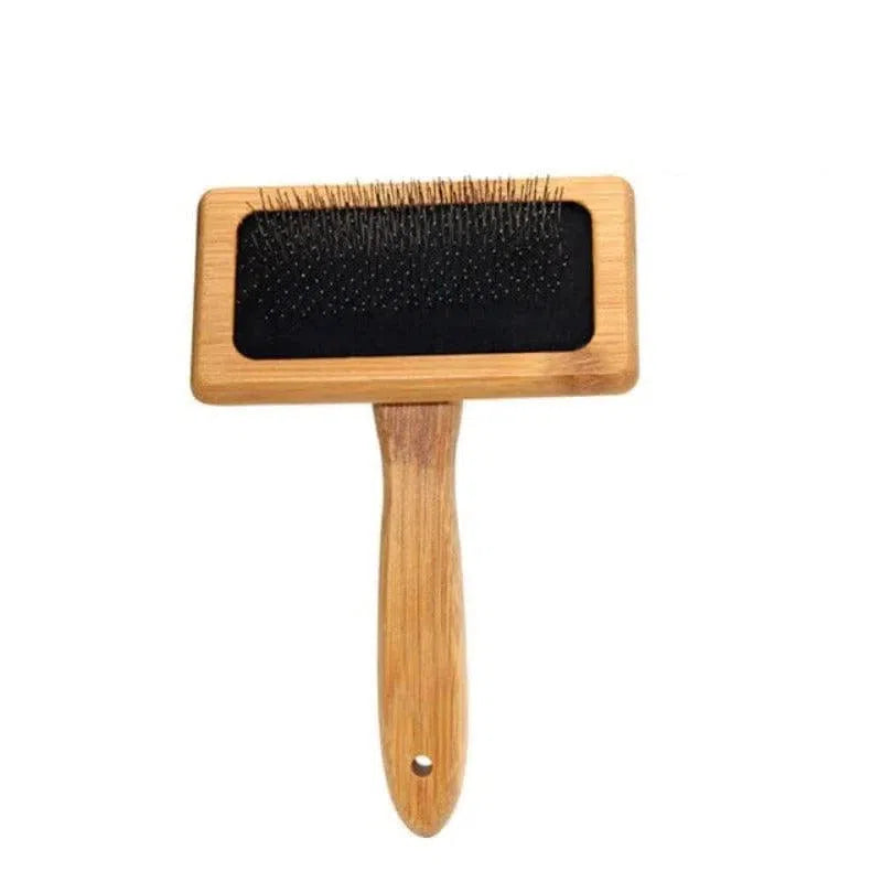 Brosse pour animaux avec manche ergonomique, idéale pour démêler les poils et réduire la perte de poils, parfaite pour chiens et chats, facile à utiliser pour un toilettage efficace.