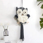 Suspension murale décorative en forme de chouette, idéale pour ajouter une touche bohème et chaleureuse à votre intérieur. Parfait pour le salon, la chambre d'enfant ou un bureau. Élégance et originalité s'associent pour embellir votre espace avec style.